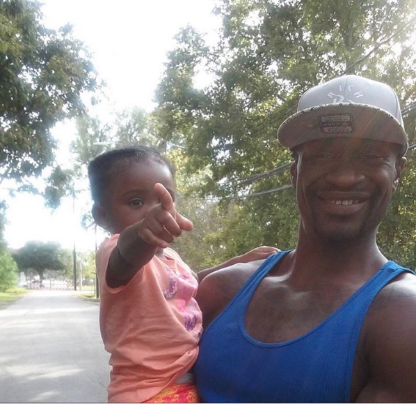 Pictured: George Floyd, smiling and holding his daughter Gianna